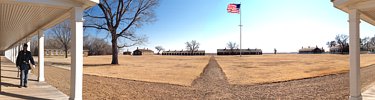 View from between barracks buildings of parade ground.